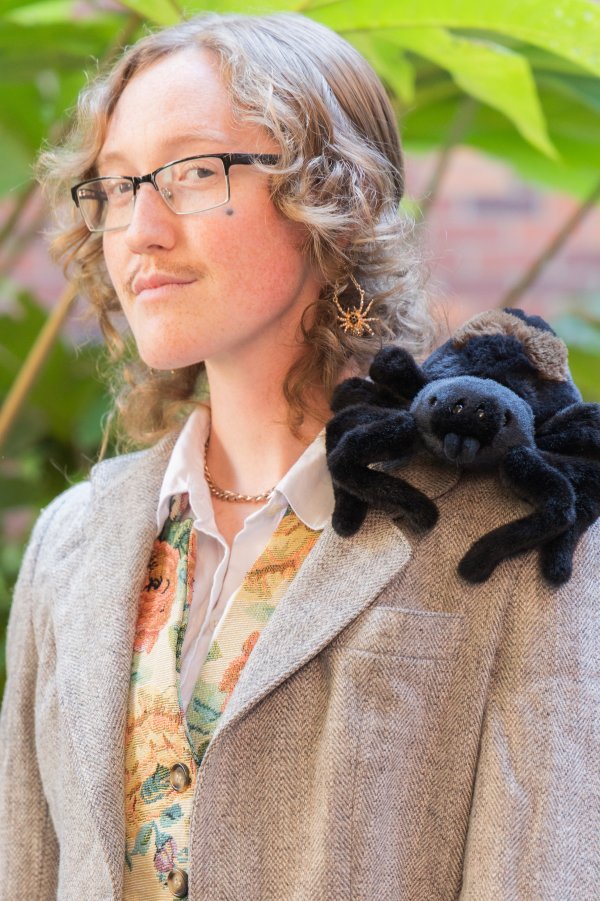 head shot of Rowan Nolan with stuffed spider on shoulder
