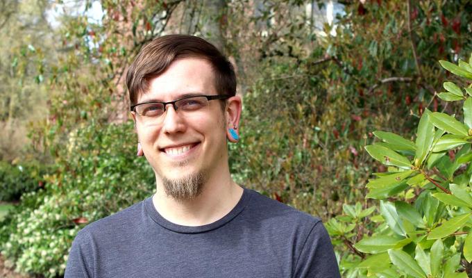 David Lynn Hubert in front of shrubbery