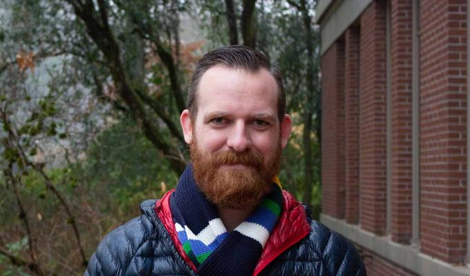 James Molyneux standing in front of Kidder Hall
