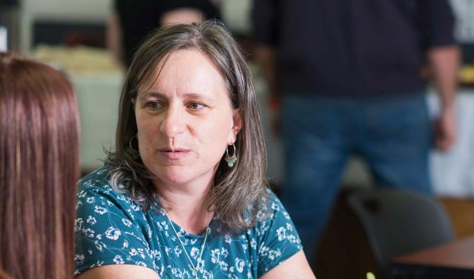 Lori Kayes talking with a student