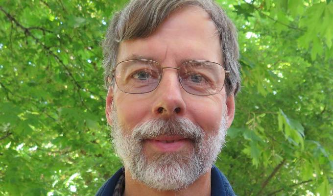 David Maddison standing in front of shrubbery