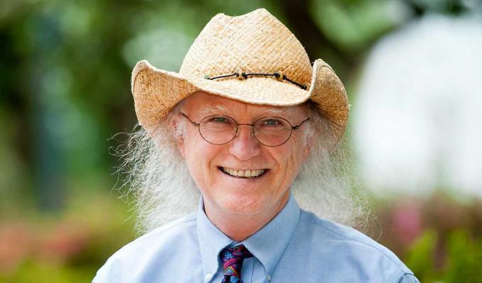 Kevin Ahern in front of garden