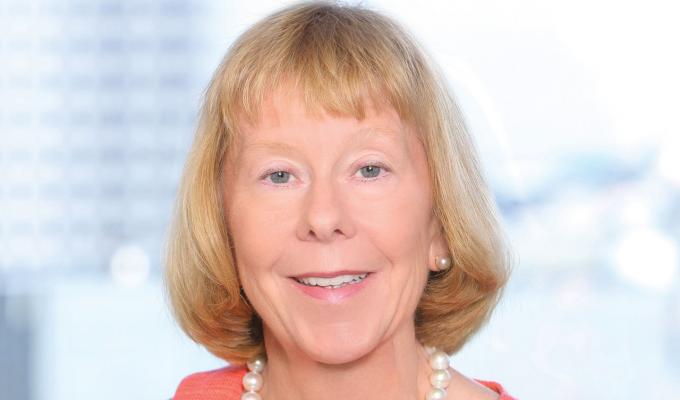 Suzanne McGrath in front of cityscape view