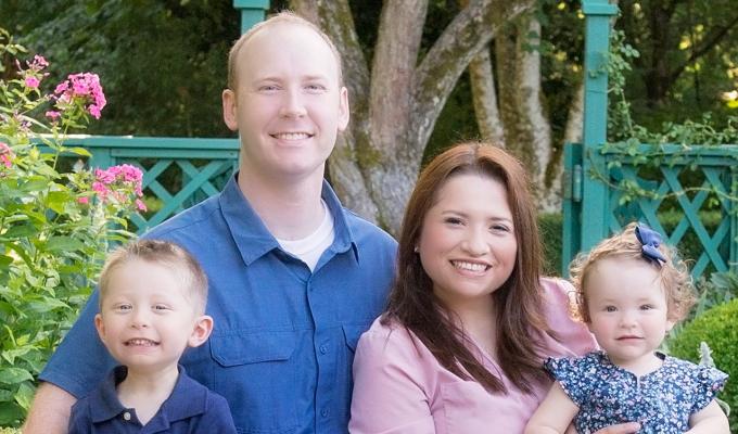 Drs. Luisa and Nathan Snyder with their children in garden