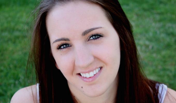 Claire Ostertag Hill sitting in grass