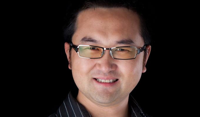 Xiulei David Ji in front of black backdrop