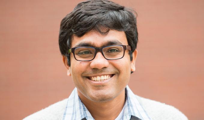 Debashis Mondal in front of brick wall