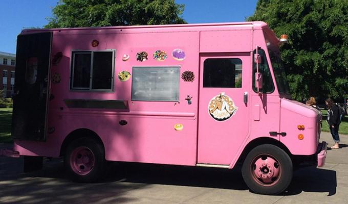Pink Voodoo truck sitting in front of Milne