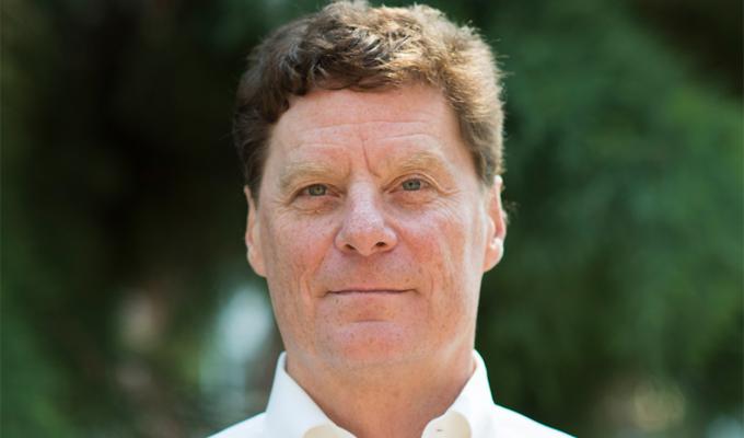 Bill Bogley in front shrubbery