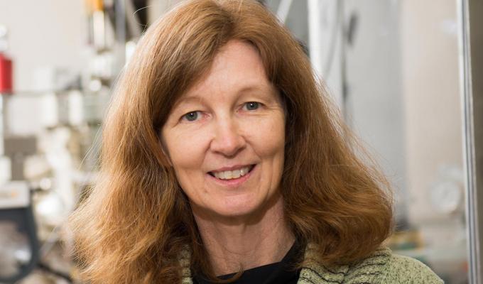 Janet Tate standing in lab