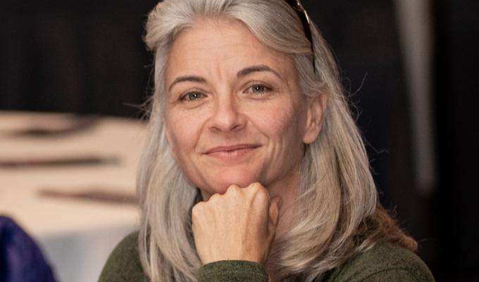 Rebecca Vega Thurber sitting with colleagues at table