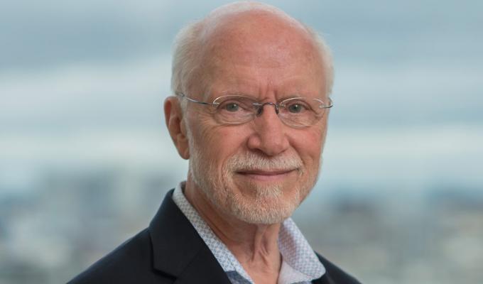 Kent Thornburg standing in front of view of cityscape