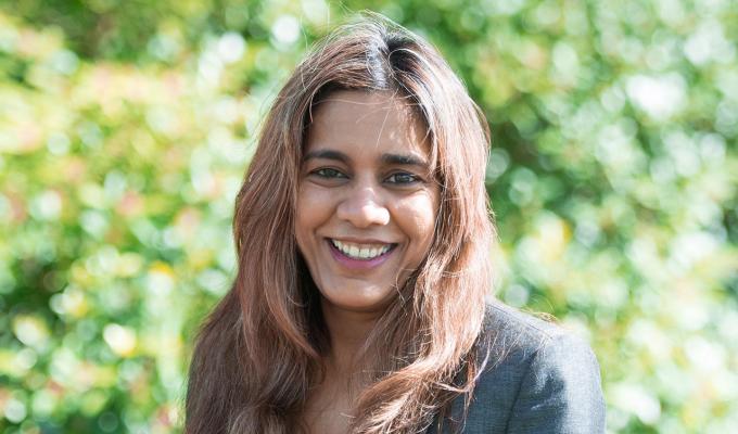 Vrushali Bokil in front of shrubbery