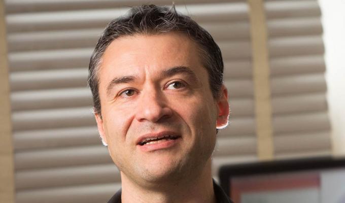 Davide Lazzati standing in office space