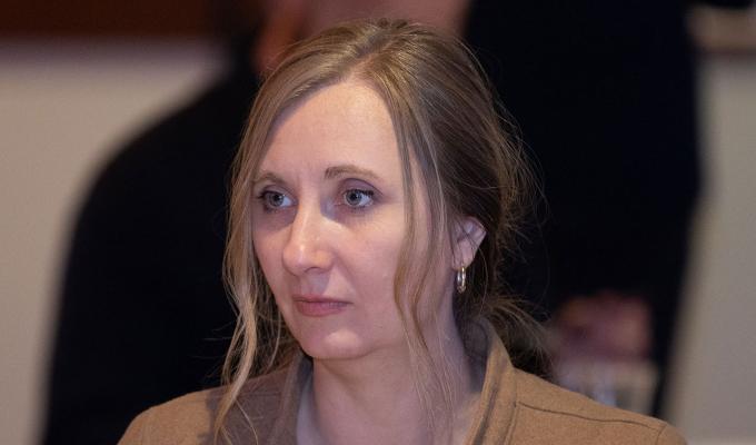Tamara Mitchell sitting in table with colleagues