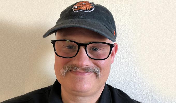 Ben Lyons in front of white backdrop