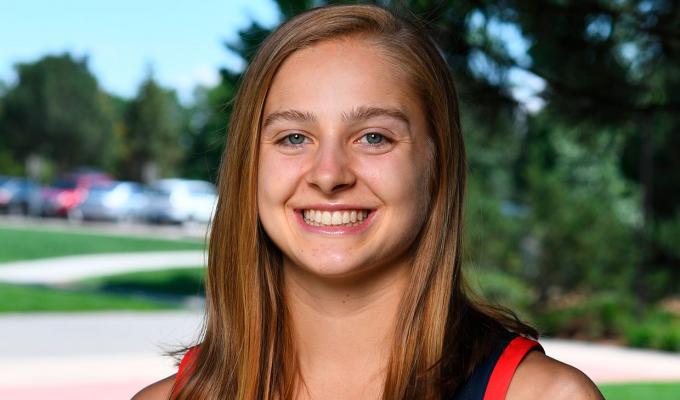 Mikayla Pivec standing in outdoor plaza, wearing a USA basketball jersey