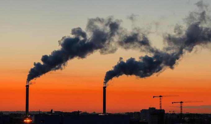 Factory in front of sunset.