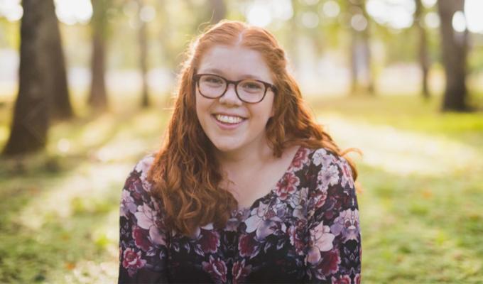 Abigail LaVerdure smiles at camera outside