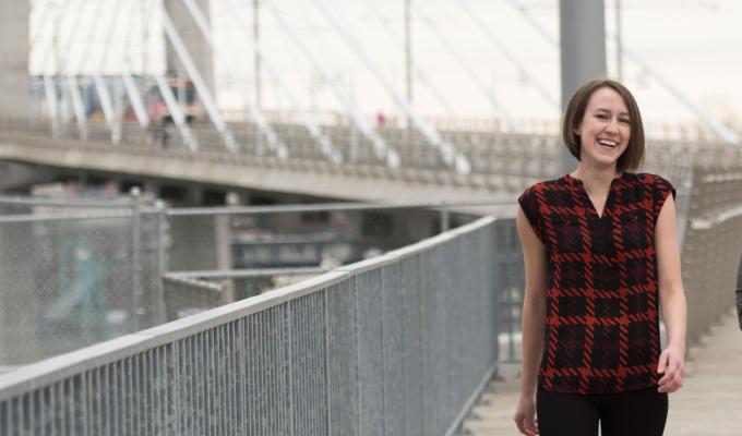 Woman on bridge smiling