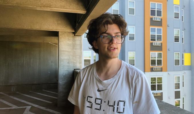 Sullivan Bailey-Darland in front of an urban backdrop.
