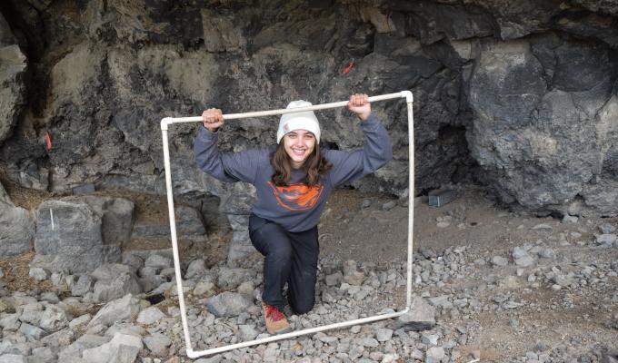 Manon Vezinet in an underground cave wearing an Oregon State University sweatshirt.