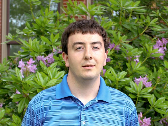 Jonathan Van Why standing outside of Kidder Hall