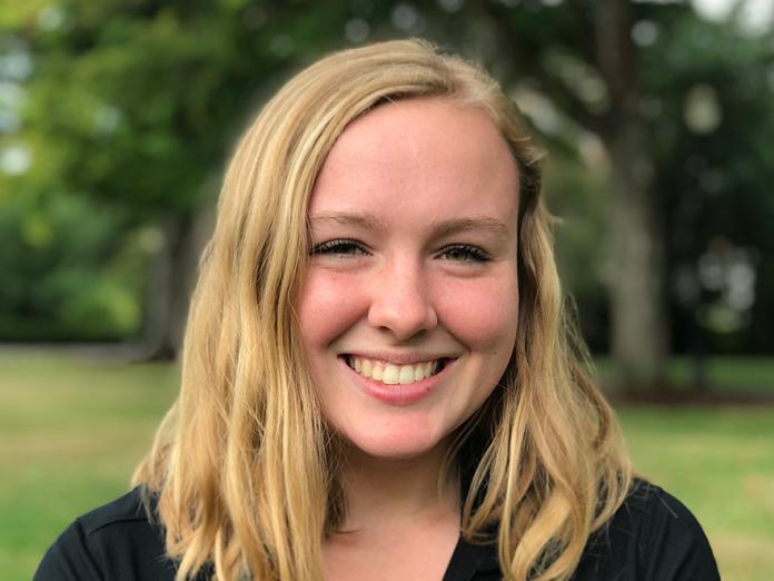 Madeline Bloom standing outside Kidder Hall