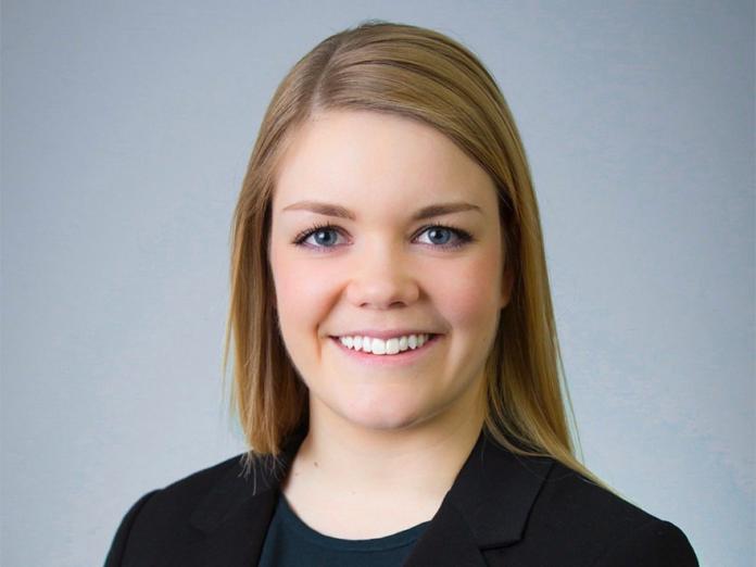 Shan Lansing, a woman with long blonde hair, smiling.