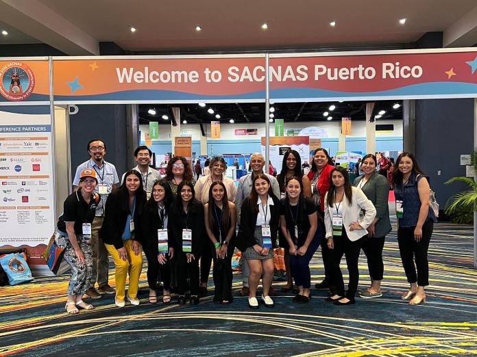 Large group of people smiling at the camera