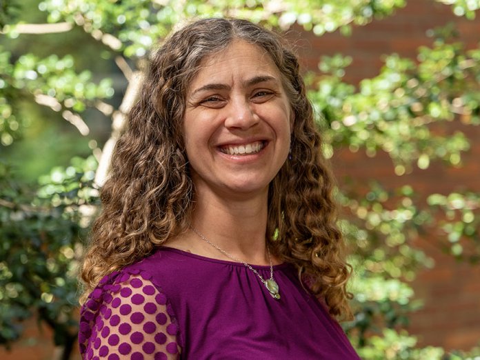 Sarah Henkel smiling headshot on campus