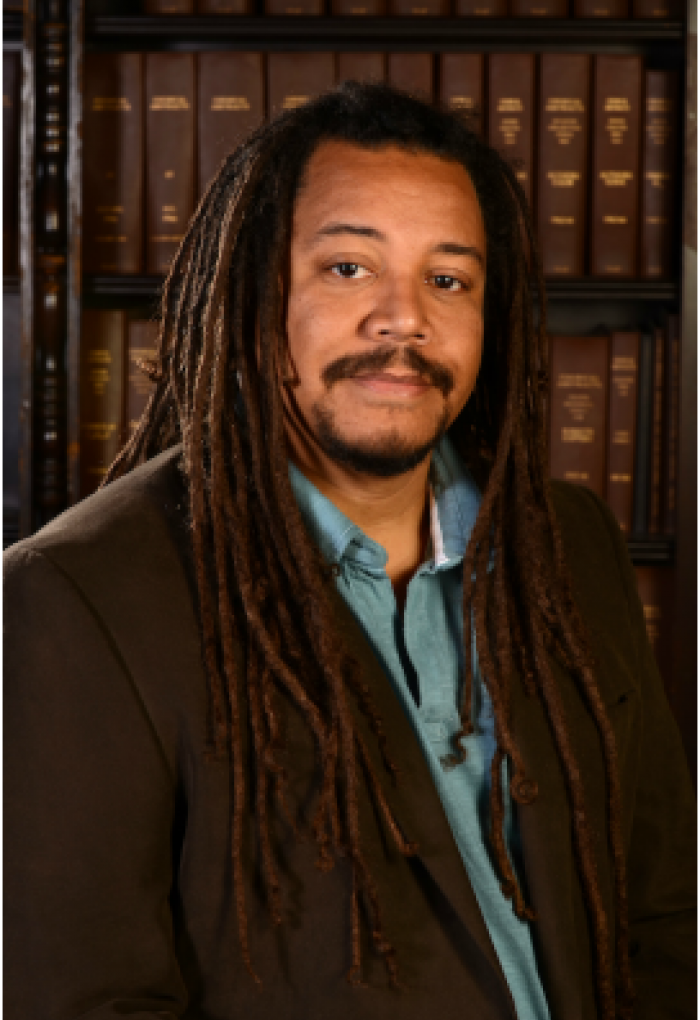 Bil Clemons in front of encyclopedias