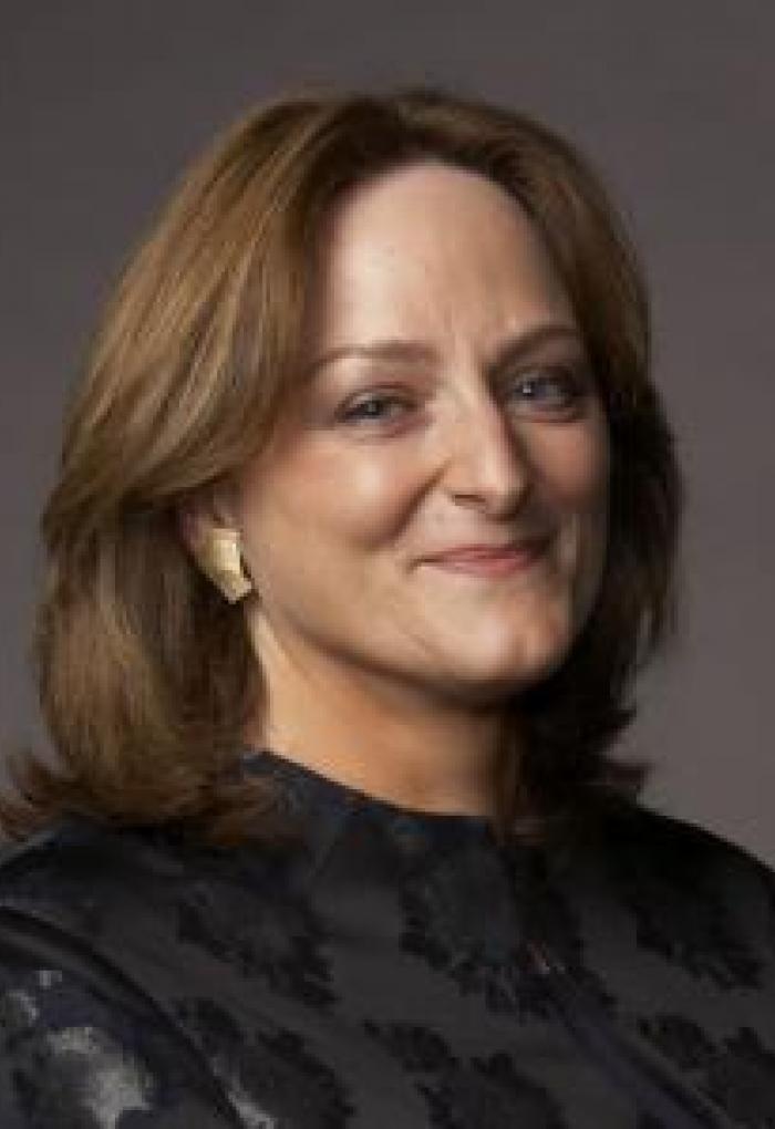 Meg Urry in front of grey backdrop