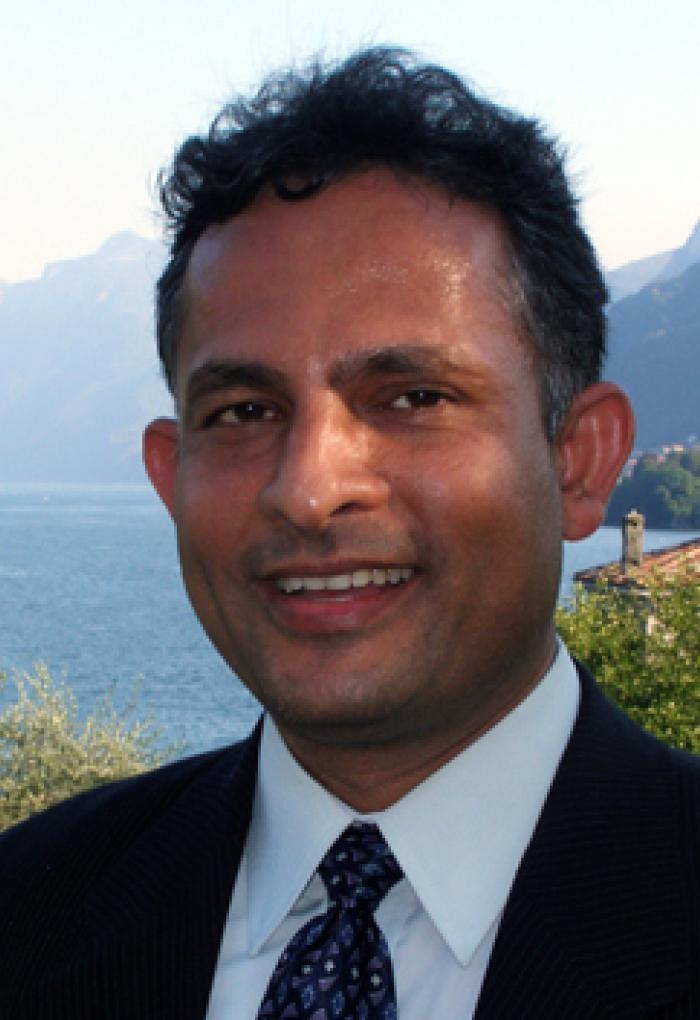 Ramesh Krishnamurthy in front of lake bay