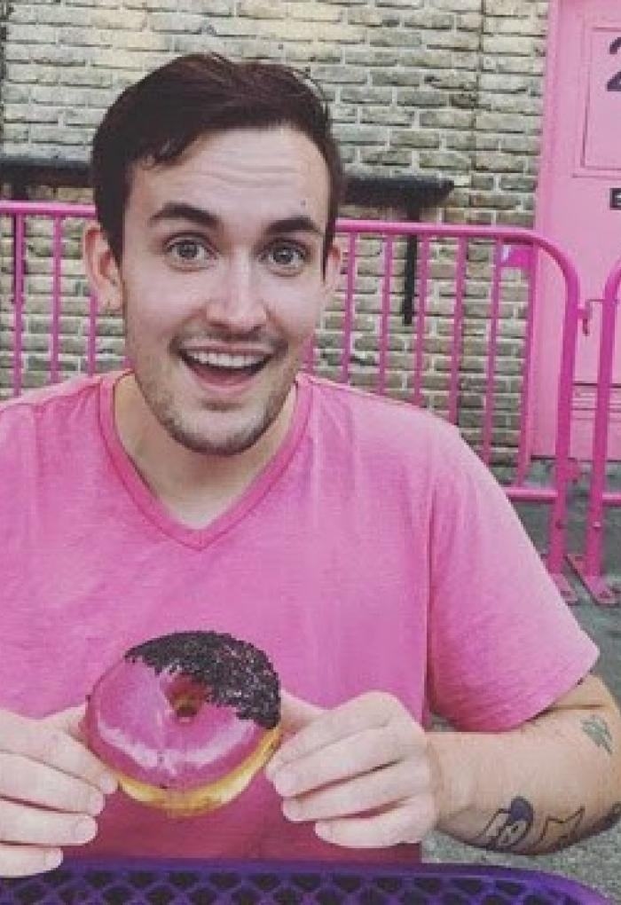 Bryan Lynn holding a donut