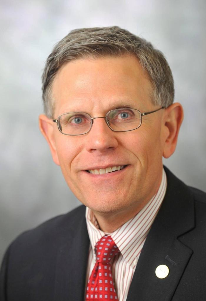Kelvin K. Droegemeier, a man in glasses wearing a suit.