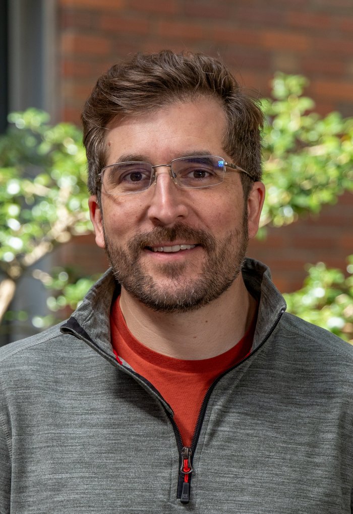 headshot of Adam Chouinard