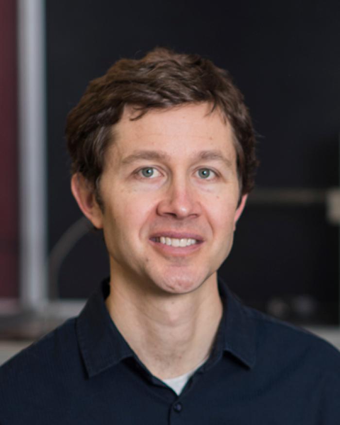 Ethan Minot sitting in lab space