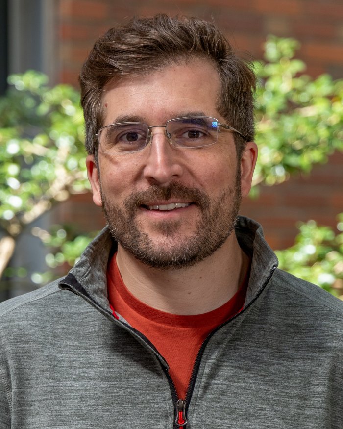 headshot of Adam Chouinard