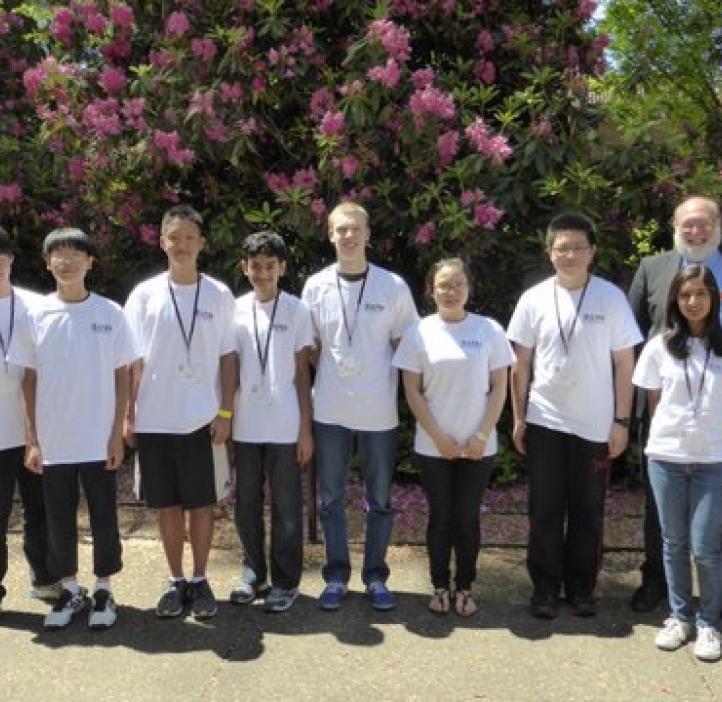 Group photo in front of shrubbery