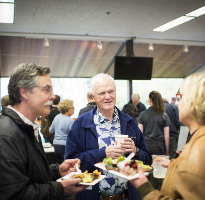 colleagues chatting over food in lobby