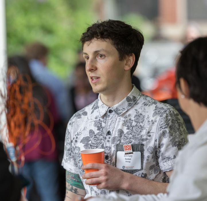 student with colleagues