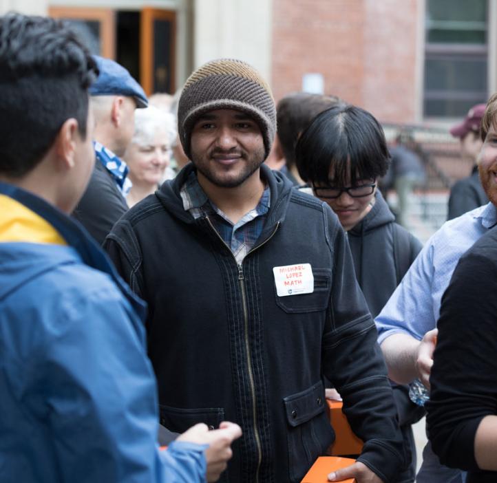 Michael Lopez chatting with students