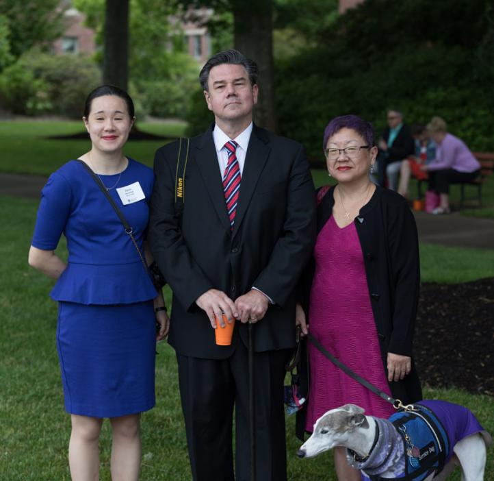 Student with parents and dog