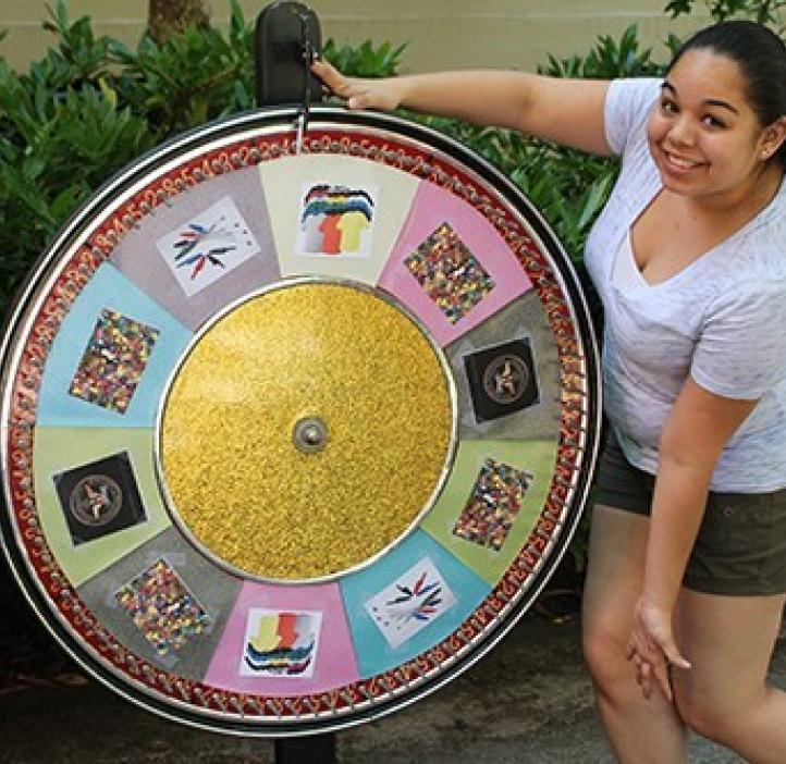 student spinning chemistry wheel