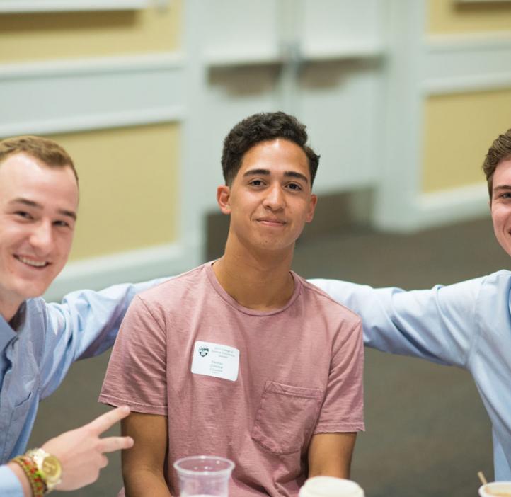 male students sitting around table