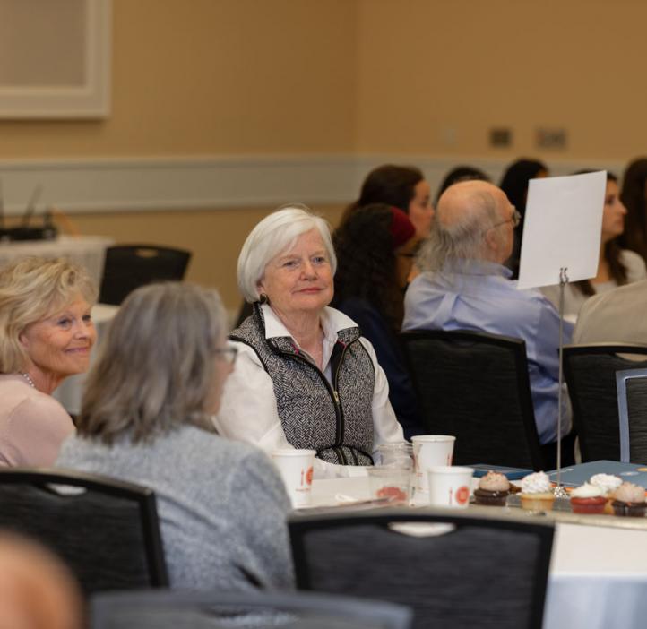 faculty and colleagues sitting at table