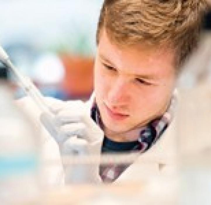 Connor Driscoll working with lab samples