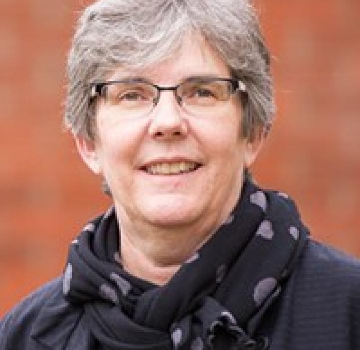 Heidi Schellman in front of a brick wall