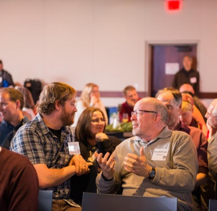 Awards ceremony attendees work together on a problem posed by guest presenters ESTEME